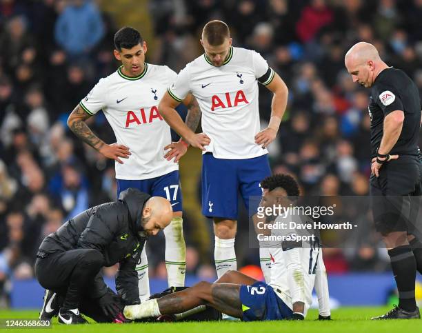 Tottenham Hotspur's Emerson Royal receives treatment during the Premier League match between Manchester City and Tottenham Hotspur at Etihad Stadium...