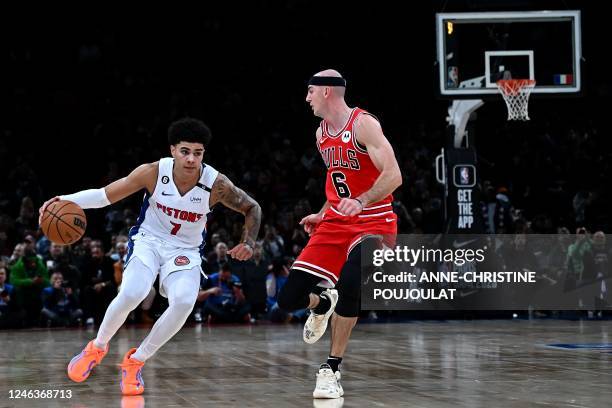 Detroit Pistons' French guard Killian Hayes fights for the ball with Chicago Bulls' US point guard Alex Caruso during the 2023 NBA Paris Games...