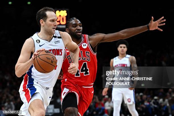 Detroit Pistons' Croatian power forward Bojan Bogdanovic fights for the ball with Chicago Bulls' US power forward Patrick Williams during the 2023...