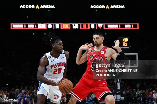 Detroit Pistons' US forward-center Isaiah Stewart fights for the ball with Chicago Bulls' Montenegrin center Nikola Vucevic during the 2023 NBA Paris...