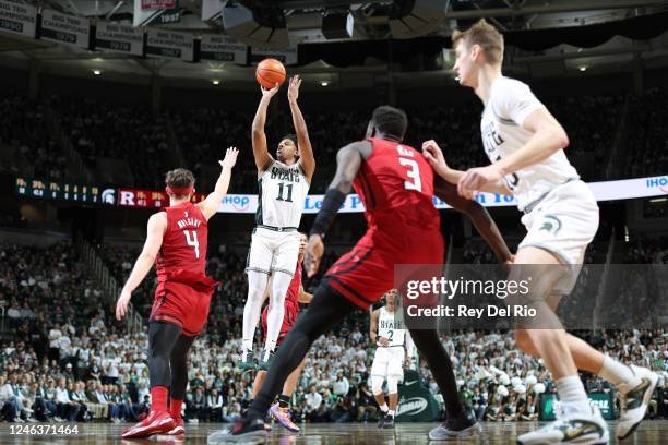 Hoggard of the Michigan State Spartans shoots over Paul Mulcahy of the Rutgers Scarlet Knights during the first half at Breslin Center on January 19,...