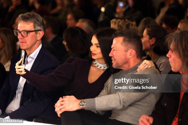 Anastasia Matthäus and Lothar Matthäus take a selfie during the fashion show BOGNER CELEBRATES MARIA 23 presenting the new Fall/Winter collection...