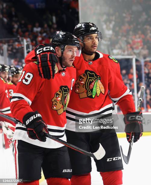Jonathan Toews of the Chicago Blackhawks celebrates his second period goal against the Philadelphia Flyers with Seth Jones at the Wells Fargo Center...