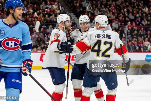 The Florida Panthers celebrate after scoring a goalduring the second period of the NHL regular season game between the Montreal Canadiens and the...