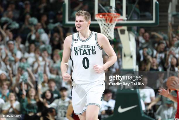 Jaxon Kohler of the Michigan State Spartans celebrates late in the second half against the Rutgers Scarlet Knights at Breslin Center on January 19,...