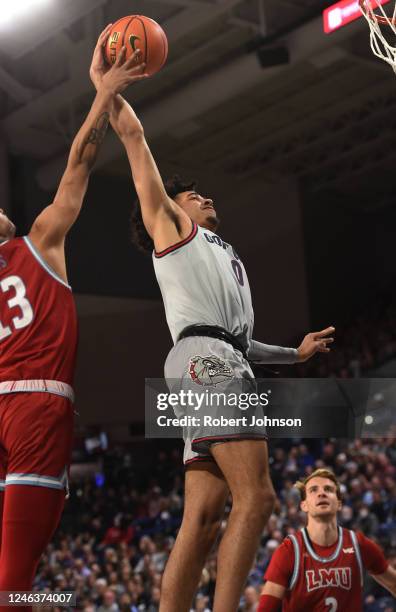 Julian Strawther of the Gonzaga Bulldogs is fouled on his dunk attempt by Lamaj Lewis of the Loyola Marymount Lions during the first half of the game...