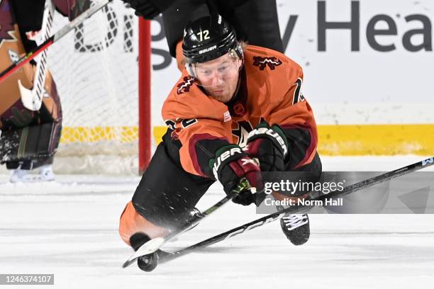 Travis Boyd of the Arizona Coyotes dives to clear a puck during the first period against the Washington Capitals at Mullett Arena on January 19, 2023...