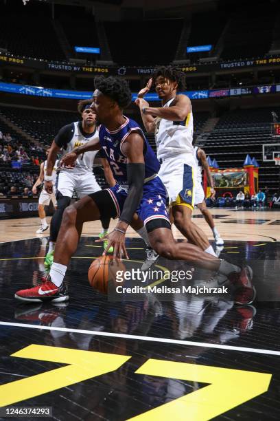 Salt Lake City, UT Tyler Cook of the Salt Lake City Stars drives against Justin Anderson and Jermaine Samuels Jr. #23 of the Fort Wayne Mad Ants at...