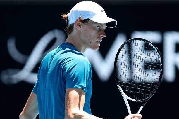 Italy's Jannik Sinner reacts on a point against Hungary's Marton Fucsovics during their men's singles match on day five of the Australian Open tennis...