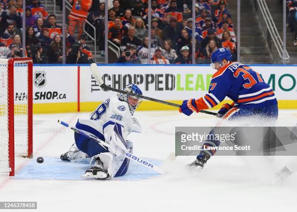 Andrei Vasilevskiy of the Tampa Bay Lightning makes a save on Warren Foegele of the Edmonton Oilers in the third period at Rogers Place on January...