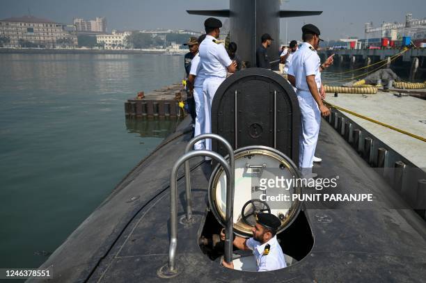 Indian navy officers are seen on the deck of fifth Kalvari-Class submarine 'Vagir' anchored at the naval base ahead of its commissioning ceremony in...