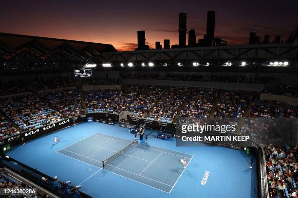 This picture shows a general view at sunset of the Rod Laver Arena during the men's singles match between Canada's Denis Shapovalov and Poland's...