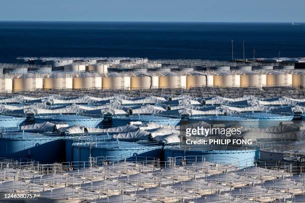 General view shows storage tanks for contaminated water at the Tokyo Electric Power Company's Fukushima Daiichi nuclear power plant, in Okuma of...
