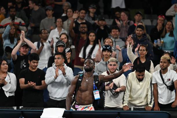 Frances Tiafoe of the US waves after losing to Russia's Karen Khachanov in their men's singles match on day five of the Australian Open tennis...