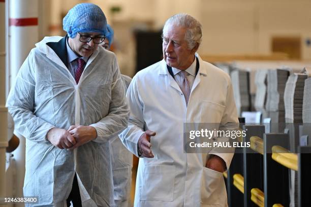 Britain's King Charles III tours the headquarters of cereal manufacturer Kellogg's marking its 100th anniversary in Manchester, north west England,...