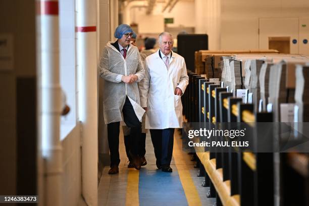 Britain's King Charles III tours the headquarters of cereal manufacturer Kellogg's marking its 100th anniversary in Manchester, north west England,...