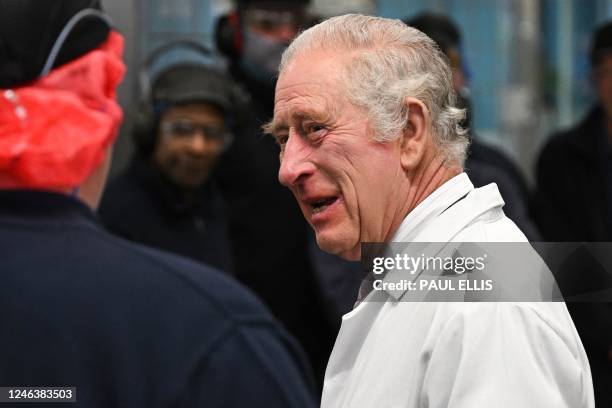 Britain's King Charles III tours the headquarters of cereal manufacturer Kellogg's marking its 100th anniversary in Manchester, north west England,...