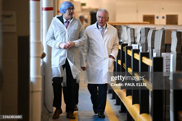 Britain's King Charles III tours the headquarters of cereal manufacturer Kellogg's marking its 100th anniversary in Manchester, north west England,...