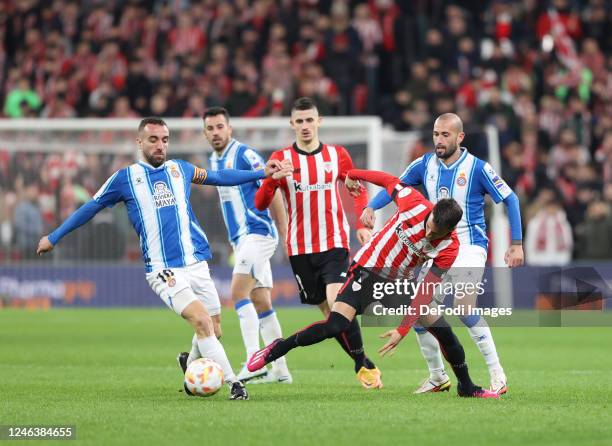 Alex Berenguer of Athletic Bilbao and Sergi Darder of RCD Espanyol battle for the ball during the Copa Del Rey match between Athletic Club and RCDE...