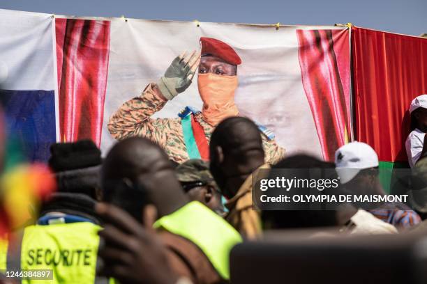 Banner of the Burkina Faso President Captain Ibrahim Traore is seen during a protest to support him and to demand the departure of France's...