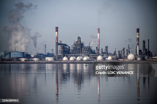 This picture taken on January 20, 2023 from Paimboeuf shows a view of the Total Energies oil refinery of Donges, western France.
