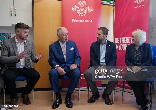 Britain's King Charles III talks to Gareth Southgate, England football manager and Prince's Trust ambassador during a visit to the Norbrook Community...