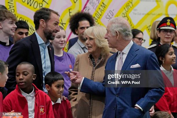 Britain's King Charles III and Camilla, Queen Consort talk with Gareth Southgate, England football manager and Prince's Trust ambassador during a...