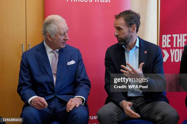 Britain's King Charles III talks to Gareth Southgate, England football manager and Prince's Trust ambassador during a visit to the Norbrook Community...