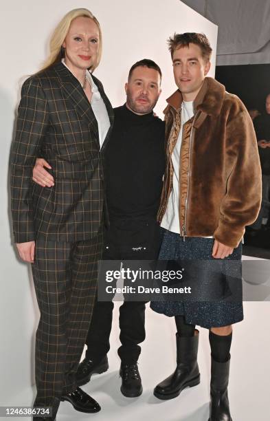 Gwendoline Christie, Kim Jones, Artistic Director of Dior Homme, and Robert Pattinson pose backstage at the Dior Homme show during Paris Fashion Week...