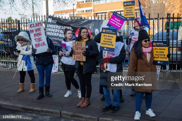 Nurses hold signs at an official picket line outside St George's Hospital in Tooting on 19 January 2023 in London, United Kingdom. Nurses in England...