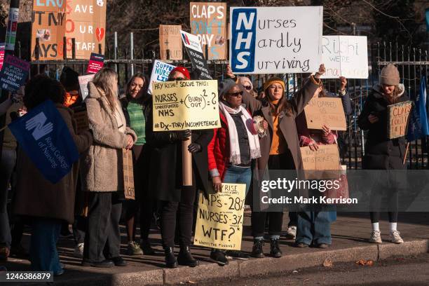 Nurses hold signs at an official picket line outside St George's Hospital in Tooting on 19 January 2023 in London, United Kingdom. Nurses in England...