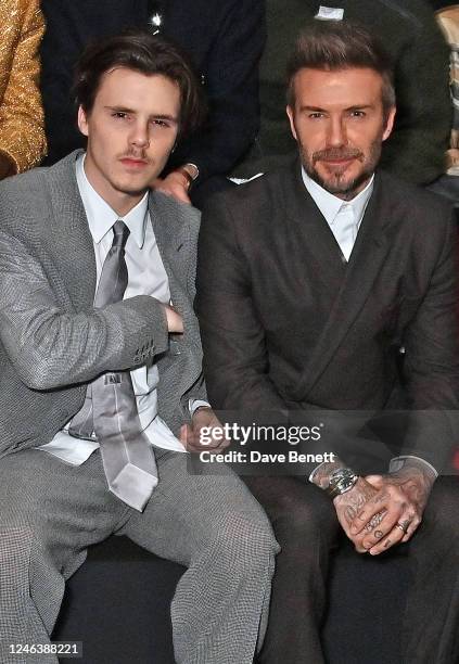 Cruz Beckham and David Beckham attend the Dior Homme front row during Paris Fashion Week Menswear Fall-Winter 2023-2024 on January 20, 2023 in Paris,...