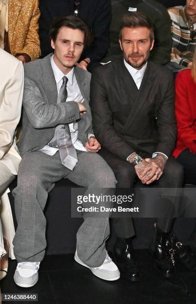 Cruz Beckham and David Beckham attend the Dior Homme front row during Paris Fashion Week Menswear Fall-Winter 2023-2024 on January 20, 2023 in Paris,...