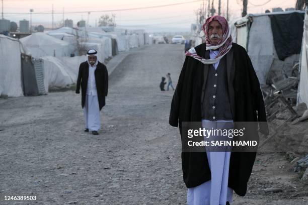 Displaced Iraqis from the Yazidi community are pictured at a camp for internally displaced persons in Khanke, a few kilometres from the Turkish...