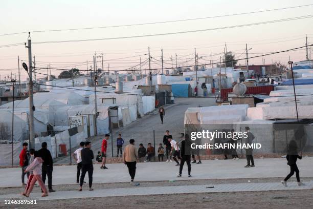 Displaced Iraqis from the Yazidi community are pictured at a camp for internally displaced persons in Khanke, a few kilometres from the Turkish...