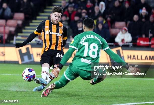 Sheffield United's Wes Foderingham saves from Hull City's Aaron Connolly during the Sky Bet Championship between Sheffield United and Hull City at...