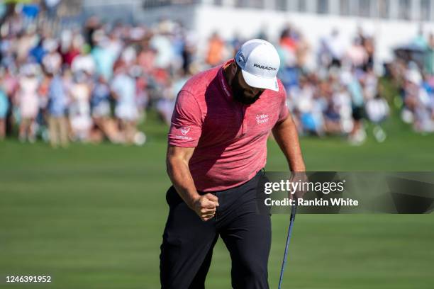 Jon Rahm celebrates making his final putt on the 18th green during the final round of the Sentry Tournament of Champions on The Plantation Course at...