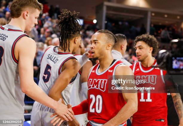 Loyola Marymount Lions guard Cam Shelton shakes hands with Gonzaga Bulldogs forward Ben Gregg after leading his team to a win against the Gonzaga...