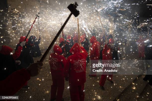 People dress up like devils dance among firecrackers in a âcorrefocâ during the celebration of Sant Antoni at the town of Morella in Castello, Spain...