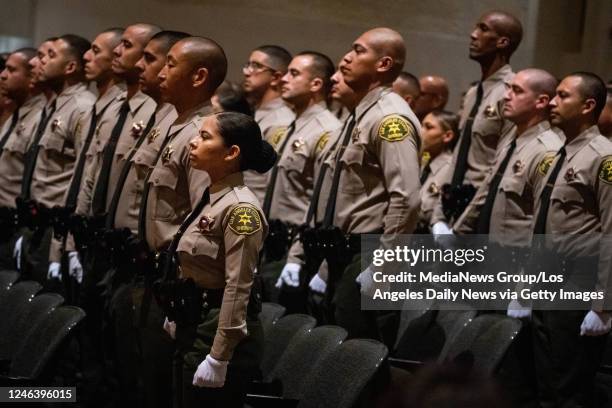 Los Angeles, CA Los Angeles County Sheriff recruit Perla Chavez of South Gate, stands with her graduating class during their swearing in ceremony at...