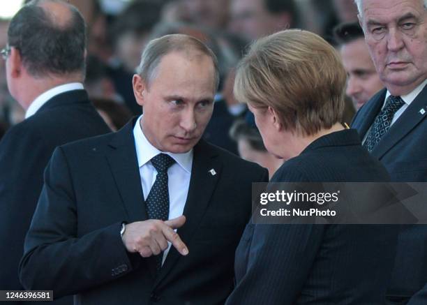 In this file photo German Chancellor Angela Merkel and Russian President Vladimir Putin came face to face as they attend commemoration ceremonies...