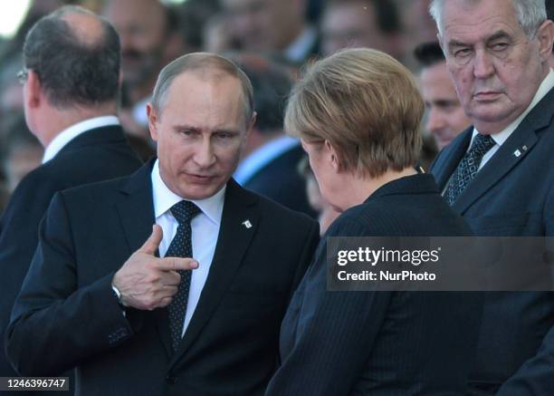 In this file photo German Chancellor Angela Merkel and Russian President Vladimir Putin came face to face as they attend commemoration ceremonies...