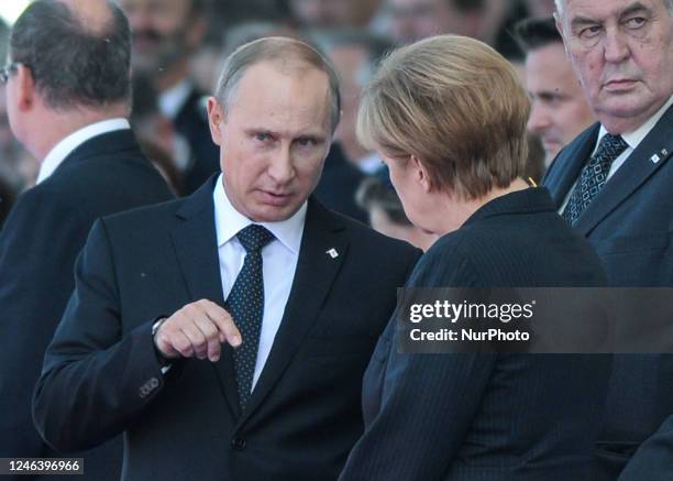 In this file photo German Chancellor Angela Merkel and Russian President Vladimir Putin came face to face as they attend commemoration ceremonies...