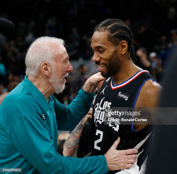 Head coach Gregg Popovich of the San Antonio Spurs greets Kawhi Leonard of the Los Angeles Clippers at the end of the game at AT&T Center on January...