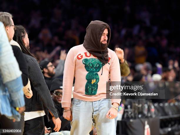 Bad Bunny reacts to Los Angeles Lakers win over Memphis Grizzlies at the end of the game at Crypto.com Arena on January 20, 2023 in Los Angeles,...