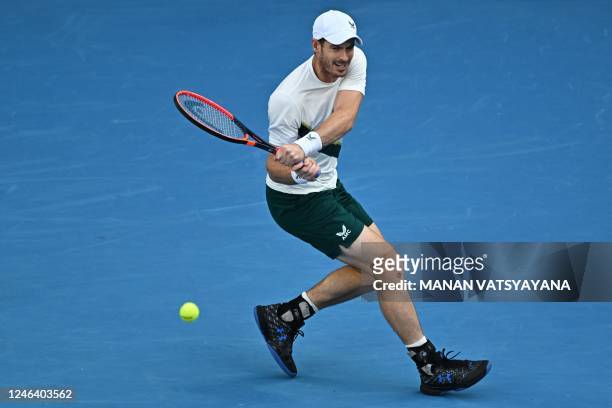 Britain's Andy Murray hits a return against Spain's Roberto Bautista Agut during their men's singles match on day six of the Australian Open tennis...