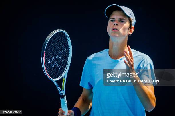 Alexander Blockx reacts during a junior boys' singles first round match between Belgian Blockx and Italian Bondioli at the 'Australian Open' tennis...
