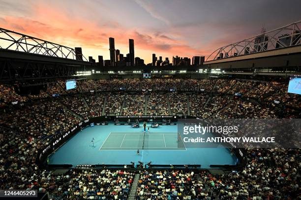 This picture shows a general view at sunset of the Rod Laver Arena during the men's singles match between Bulgaria's Grigor Dimitrov and Serbia's...