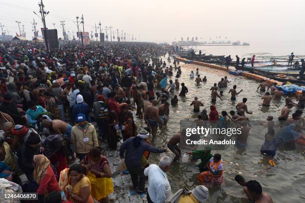 Hindu devotees gather to take a holy dip at the 'Sangam' the confluence of the rivers Ganges, Yamuna and mythical Saraswati, on the auspicious...