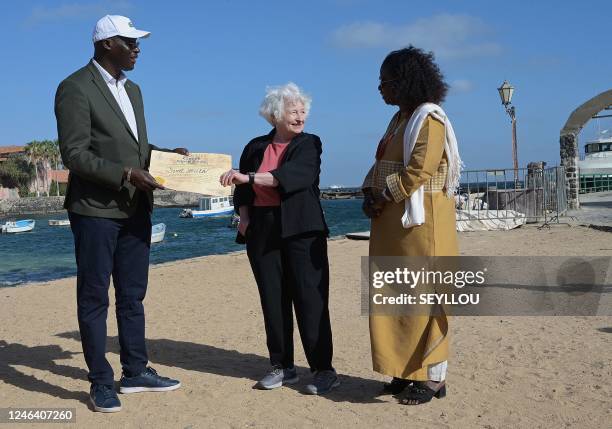 Treasury Secretary Janet Yellen receives an award diploma of Great Pilgrim from lawyer and Goree's mayor Augustin Senghor at the Goree-landing stage...